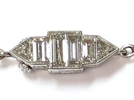 Art Deco era platinum and diamond pearl clasp with hand engraved millegrain detailing.