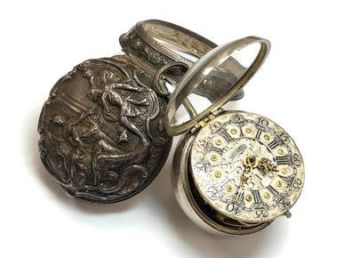 Georgian Era pair case pocket watch with repoussé sterling silver outer case,  ornate dial and hands.  Circa 1785
