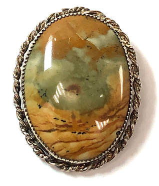 Beautiful landscape picture jasper hammer set in a sterling silver brooch with rope border
