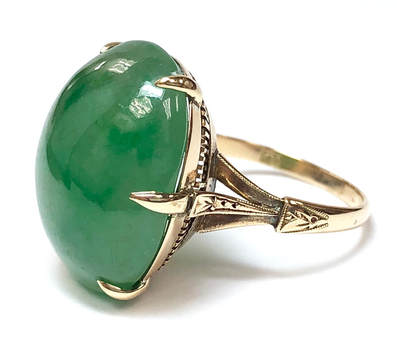 Art Deco era vintage jadeite jade ring in a custom-made, 18 karat gold setting with a filigree under gallery.