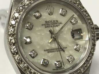 Mother of pearl shell is used on this aftermarket Rolex Datejust dial set with diamonds