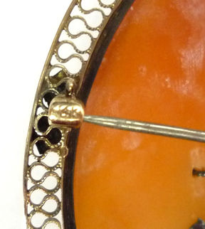 Excellent example of wire filigree work on the frame of a 14 karat gold, cameo habillé brooch