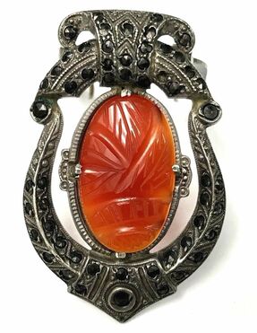 Art Deco era vintage Egyptian Revival clip brooch featuring a carved carnelian scarab and marcasite set in sterling silver