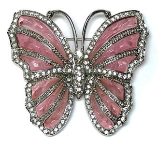 Nolan Miller butterfly brooch featuring pink plastic and clear rhinestones