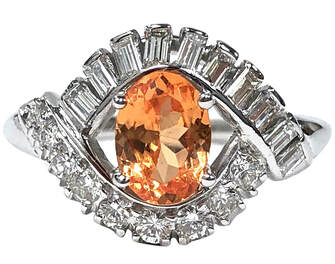 Vivid orange spessartine garnet and diamond ring in platinum