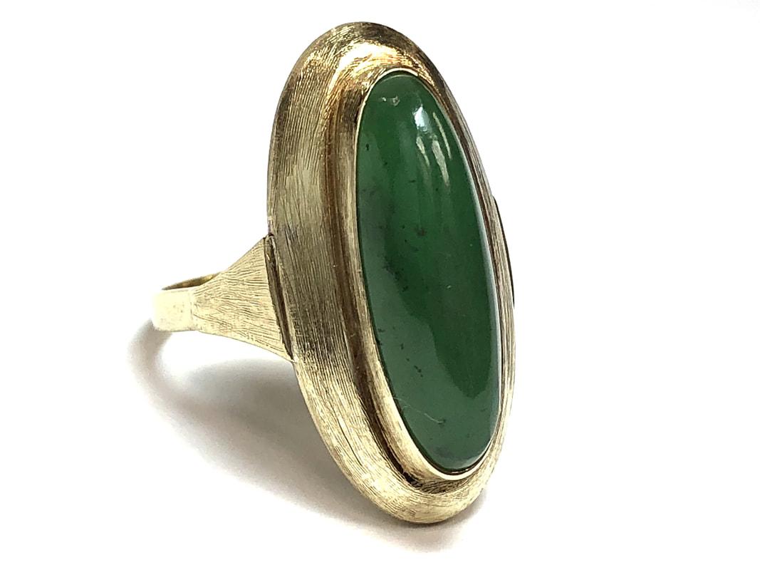 This vintage 14K gold ring is set with a beautiful hydrogrossular garnet, often mistaken for nephrite jade.