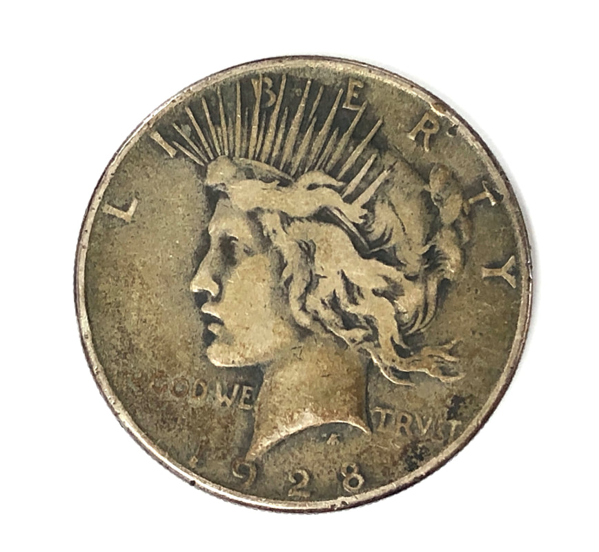 Obverse of a 1928 silver Peace Dollar