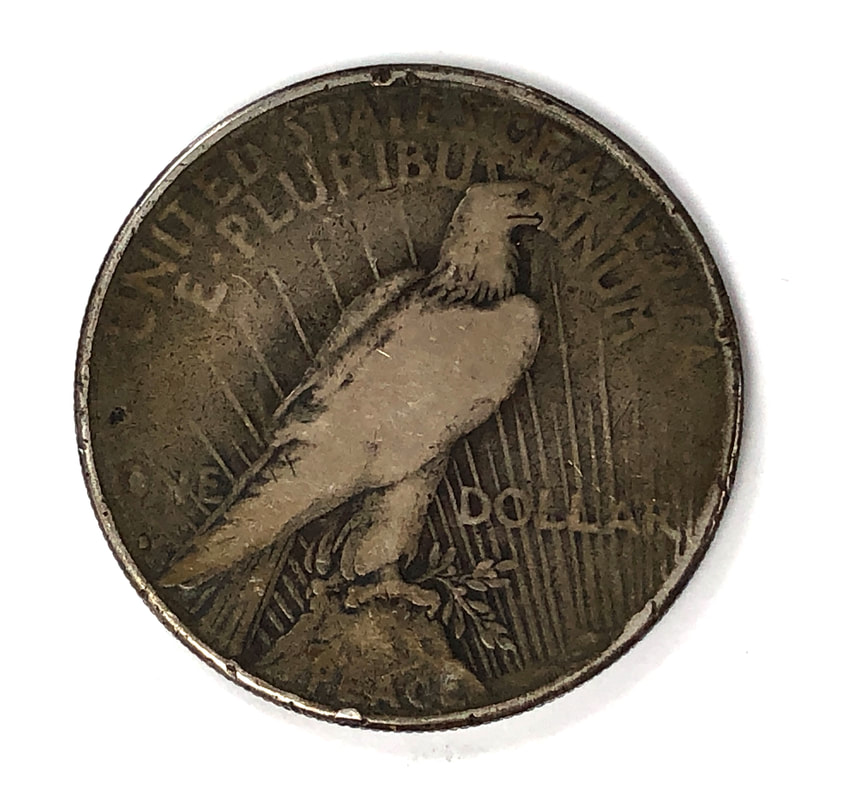 Reverse of a 1928 silver Peace Dollar