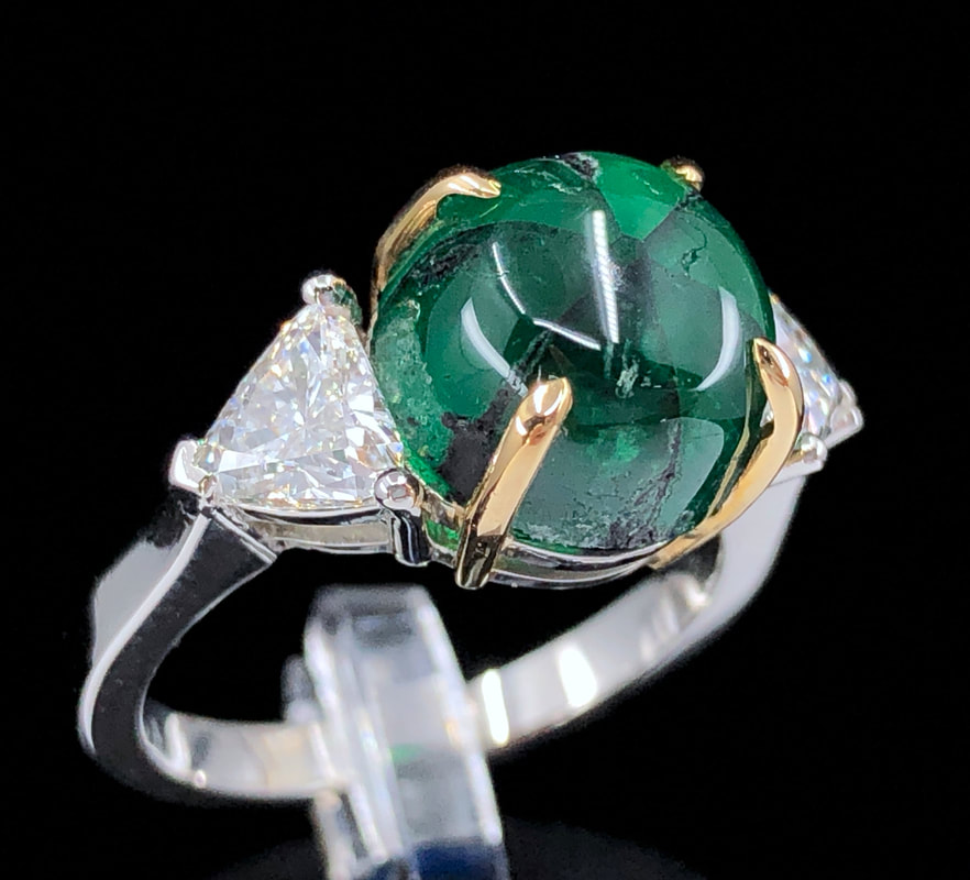 GRS 5.42 ct. natural Colombian trapiche emerald and trillion cut diamond three stone ring in platinum with 18K yellow gold claw prongs.