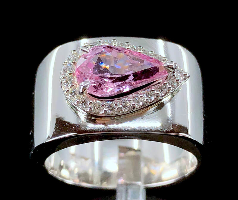 A 1.77 carat natural Padparadscha sapphire, diamond, and platinum ring with GIA Sapphire Report.