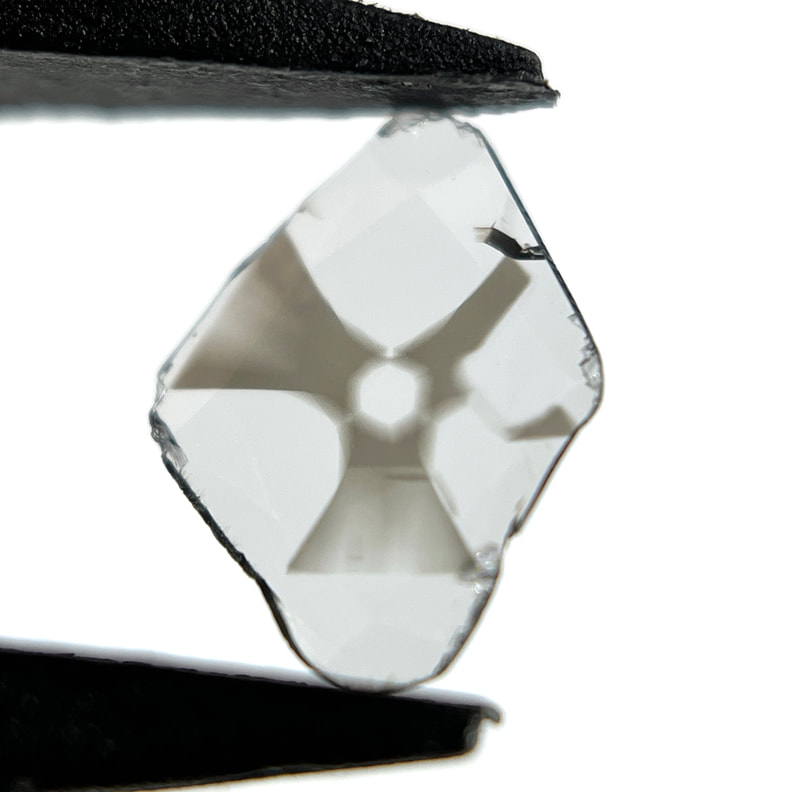 Extremely rare asteriated diamond with "radioactive" symbol-shaped inclusion