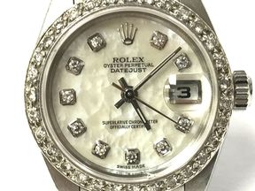 Rolex Oyster Perpetual Lady-Datejust in stainless steel with mother of pearl & diamond dial, and a customized diamond bezel.