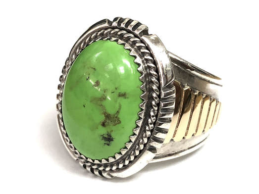 This vintage Navajo ring, by Will Denetdale, features a yellow-green gaspeite hammer set in a sterling silver & 14K gold setting