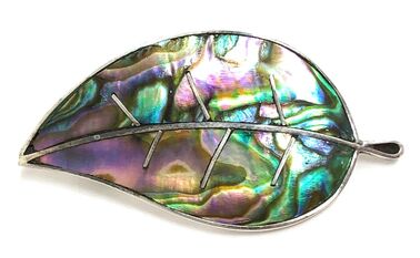 Abalone mother of pearl shell channel inlay in a sterling silver feather brooch