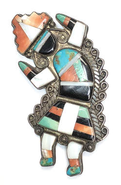This vintage, Native American Zuni brooch features a stone-to-stone inlay with turquoise, spiny oyster shell, mother of pearl and jet.