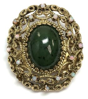 This vintage 14K gold broch is set with a beautiful hydrogrossular garnet (often mistaken for nephrite jade), and has scattered crystal opal accents.