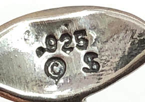 Jewelry hallmark of Shube's Mfg. Inc.