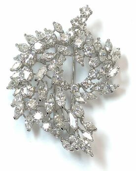 Mid Century Era vintage platinum spray brooch set with round and marquise diamonds