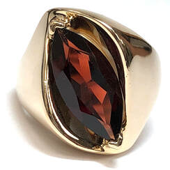 Marquise pyrope almandine garnet set diagonally in this vintage 14K gold designer ring, by Clyde Duneiere
