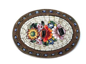 Victorian era antique micro mosaic brooch featuring a tesserae glass floral inlay.