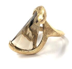 Fan-shaped fantasy cut smoky quartz set in a 14K gold textured setting