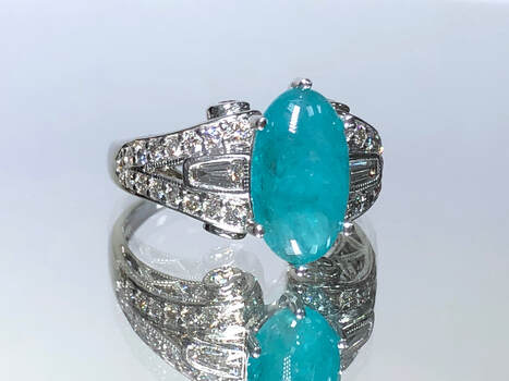 GIA Certified 2.18 ct natural Paraiba tourmaline in an 18k white gold and diamond setting