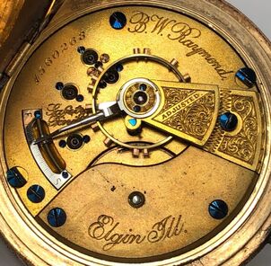 Gilt pocket watch movement, by Elgin