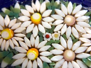Colorful tesserae glass tiles arranged in a Victorian era antique micro mosaic brooch