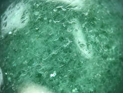 Fuschite inclusions cause a glitter effect in aventurine quartz