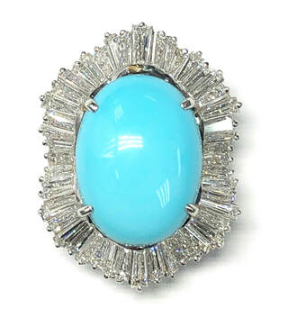 Vintage convertible pendant/ring in platinum featuring a fine turquoise with a wavy, baguette diamond surround