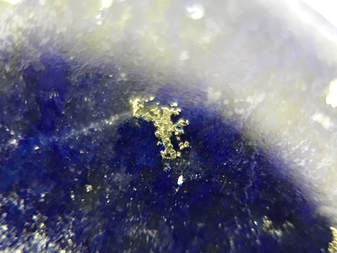 Golden pyrite and calcite inclusions in lapis lazuli