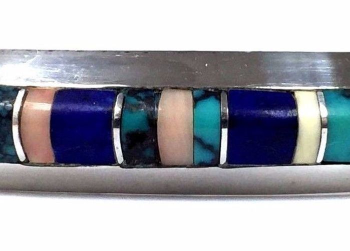 Delbert Gordon Navajo cuff bracelet set with multiple gems, including lapis lazuli.