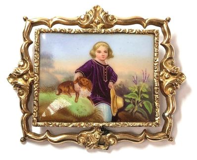 Victorian era antique brooch featuring a painted miniature on porcelain, set in a gold filled frame with ornate repoussé detailing