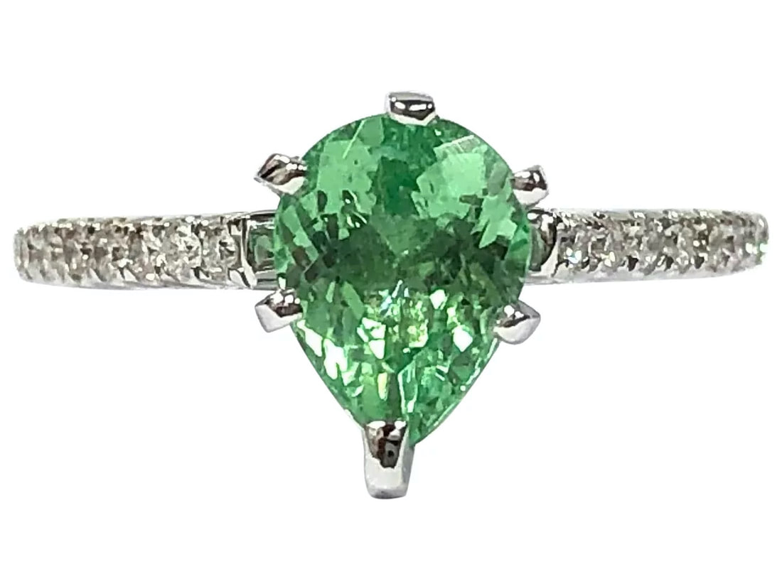A neon green Paraiba tourmaline and diamond ring in 14K white gold