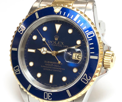 2-Tone Rolex Submariner in stainless steel & 18K Gold with blue dial and bezel