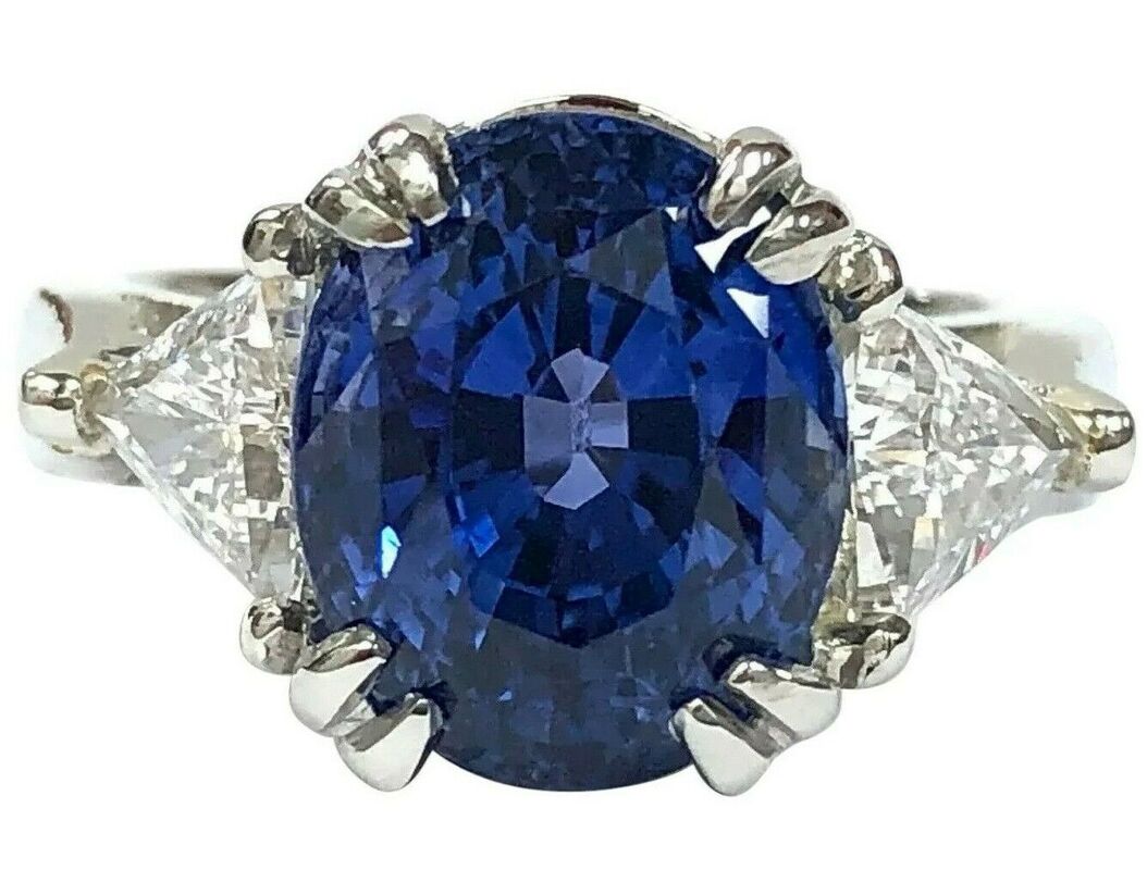 GIA 7.56 ct. color change sapphire and trillion cut diamond three-stone platinum ring