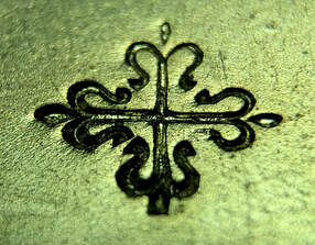 Hallmark of Patek Philippe (Calatrava Cross Pictomark)