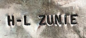 Jewelry hallmark of Zuni silversmiths, Helen & Lincoln Zunie (H-L ZUNIE)