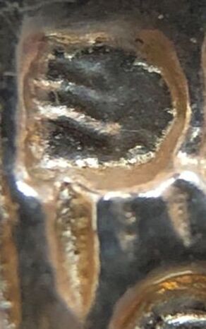 Jewelry hallmark of Aurafin (D pictomark with lines thru it)