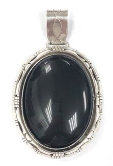 Mexican made sterling silver pendant set with a large black onyx