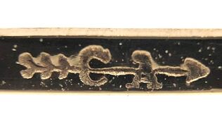 Jewelry hallmark of Carl-Art Jewelry Company, of Providence, Rhode Island (CA with an arrow thru it)