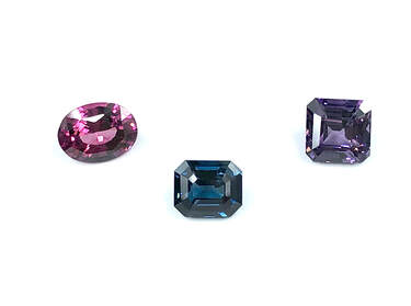 Pink spinel, greenish blue spinel, and purple spinel.