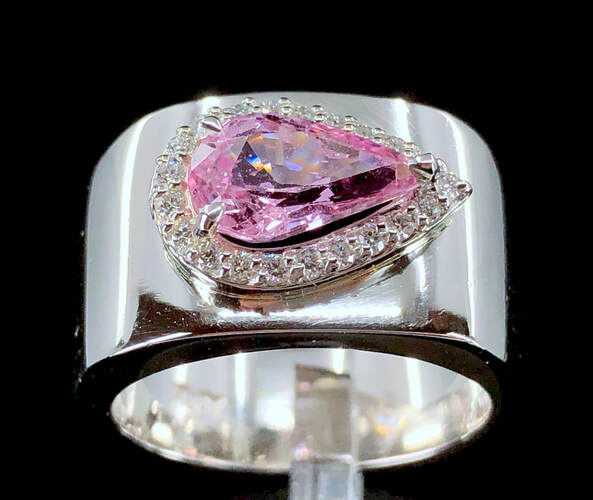 East-to-west Padparadscha sapphire and diamond ring in platinum, (GIA 1.77 ct. No Heat Padparadscha sapphire pear shape)