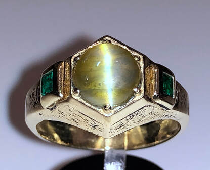 4.50 ct. cat's eye chrysoberyl and emerald ring in 14K white gold