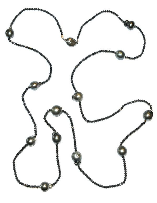 A unique baroque Tahitian cultured pearl and black diamond bead necklace