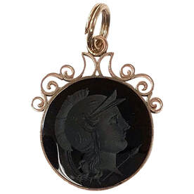 Victorian Era antique watch fob featuring a hand-carved sard intaglio set in a handmade 10K rose gold scrollwork frame