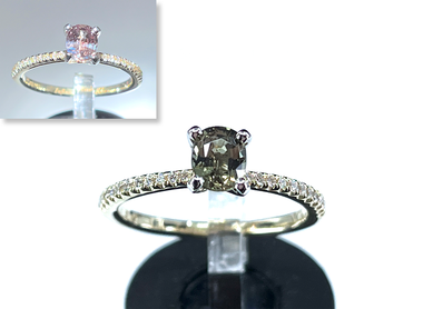A GIA 0.56 ct. natural alexandrite and diamond engagement ring in 14K gold and platinum