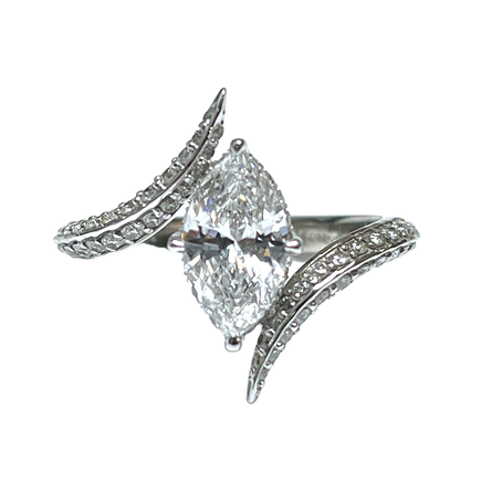 A beautiful marquise diamond centers this white gold and diamond bypass ring, by A. Altier Jewelers