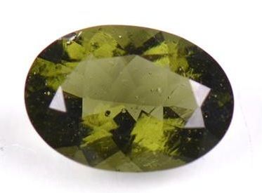 Faceted moldavite with characteristic gas bubble inclusions