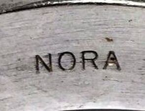 Jewelry hallmark of Nora Tahe Bill